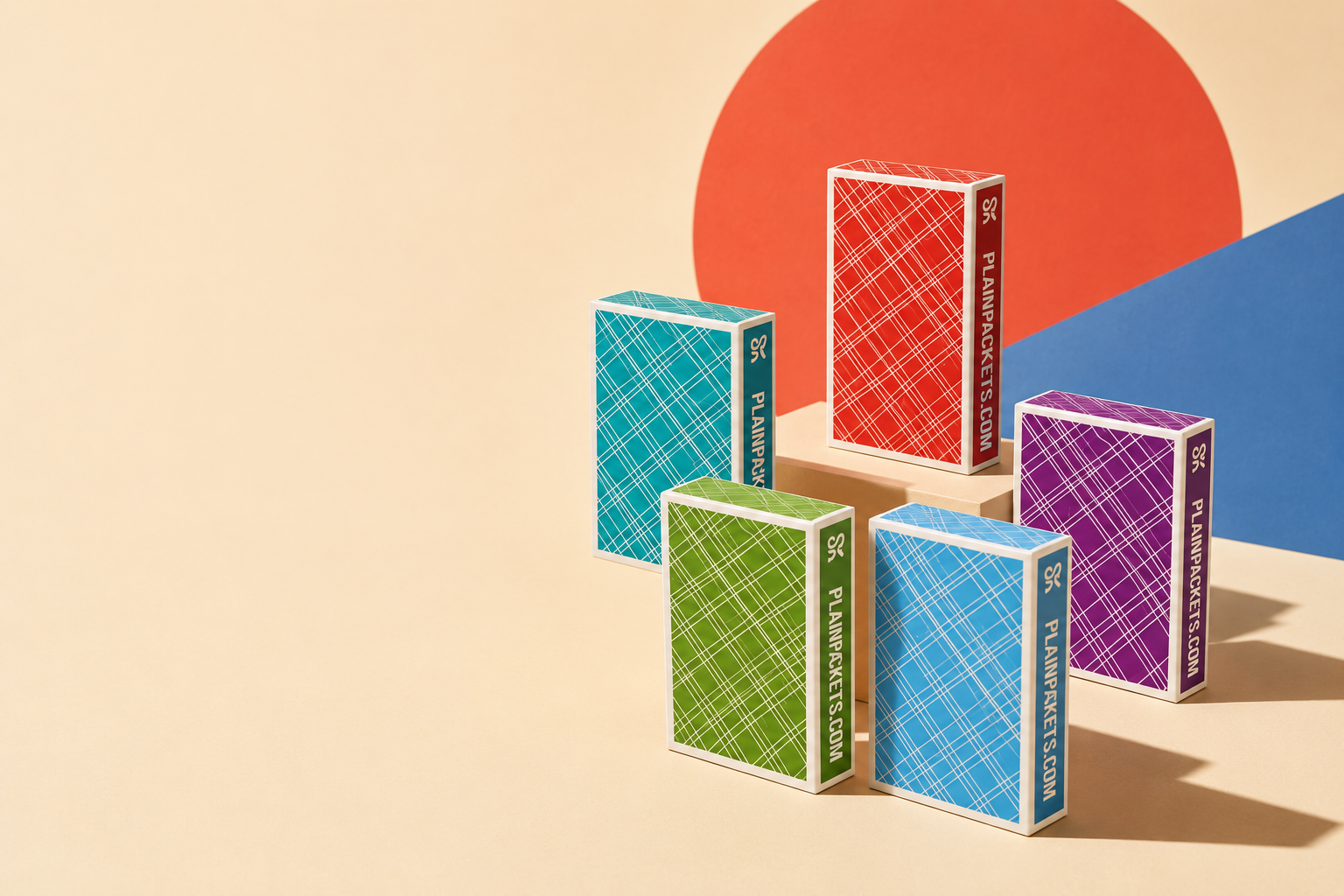 Five stylised Plain Packets covers in red, turquoise, green, purple and light blue